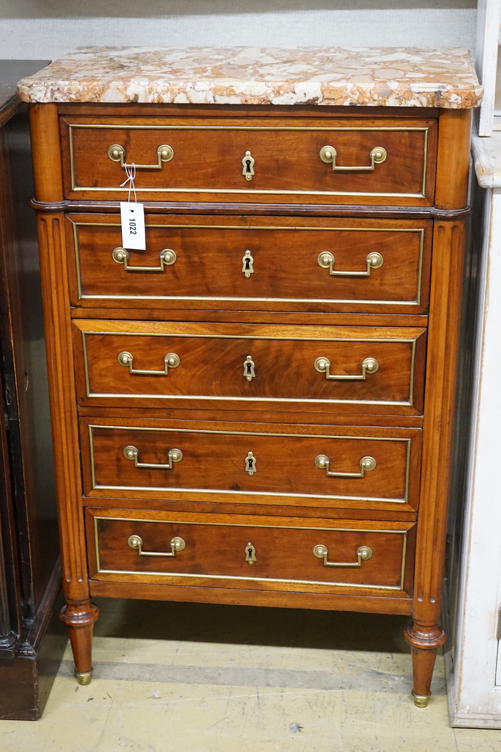 A late 19th/early 20th century French brass mounted mahogany marble top five drawer chest, width 66cm, depth 34cm, height 105cm